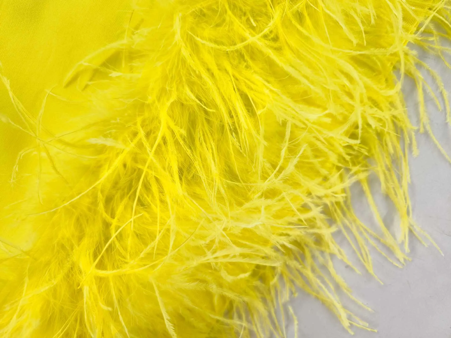 Deep V tube top ostrich feather hip-wrapped mini dress yellow