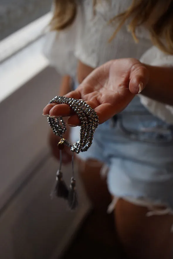 Multiple layered beaded adjustable bracelet