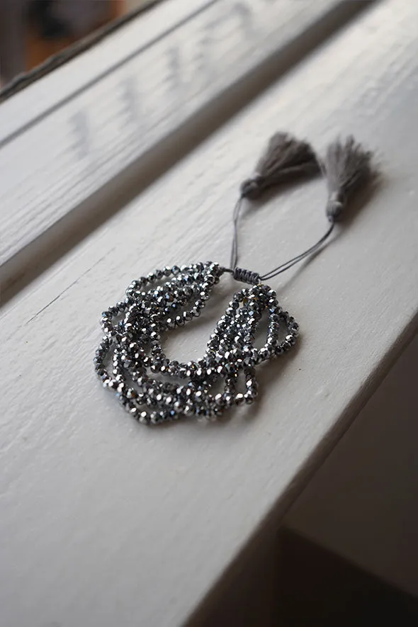 Multiple layered beaded adjustable bracelet