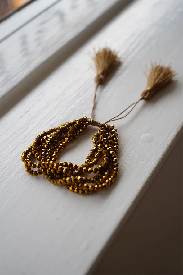 Multiple layered beaded adjustable bracelet